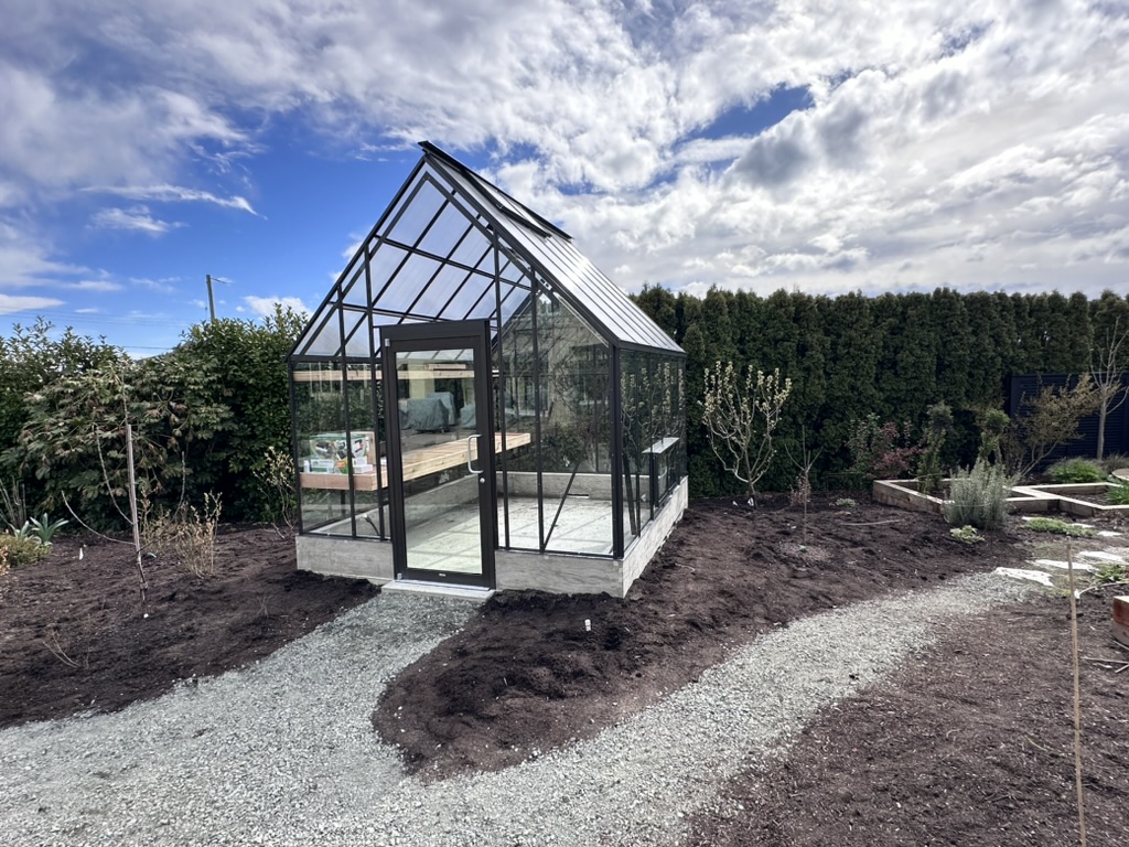 Cape Cod Cross Country Greenhouse in a winter garden