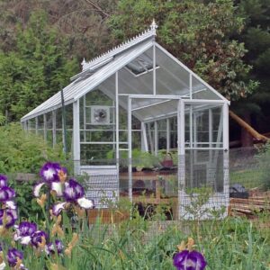 Cottage Greenhouse by Cross Country in white with single glass glazing and decorative cresting