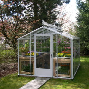 Traditional Greenhouse by Cross Country with single glass glazing and decorative cresting