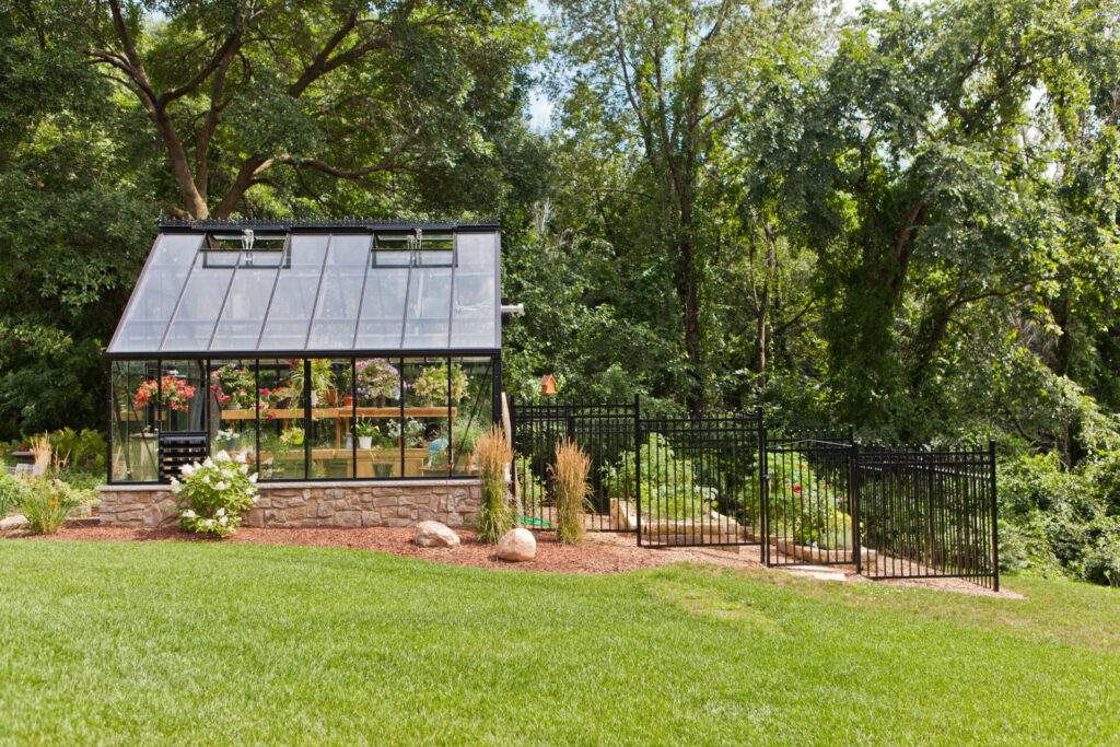 Cross Country Cape Cod 12x16 Double Glass Greenhouse with Storefront door, exhaust fan system, and decorative ridge cap