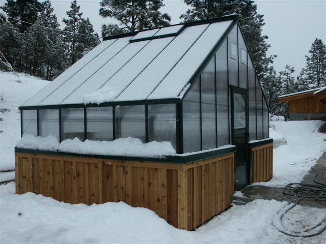 Cross Country Cape Cod 16x12 greenhouse with five wall polycarbonate glazing in the snow